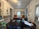 Functional office space with desk, seating, windows, and decorative touches at 715 Yew St, Charleston, SC 29407