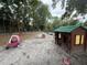 Playground with swings and a playhouse at 715 Yew St, Charleston, SC 29407