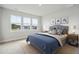 Cozy bedroom showcasing a comfortable bed, soft carpeting, and ample natural light through the windows at 78 French Garden Cir, Summerville, SC 29486