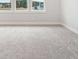 Large, empty room with plush carpeting and abundant natural light streaming through multiple windows at 78 French Garden Cir, Summerville, SC 29486