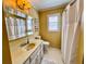 Well-lit bathroom featuring a shower with white tile and vanity at 946 Law Ln, Mount Pleasant, SC 29464