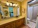 Bathroom with wood vanity and tile shower at 946 Law Ln, Mount Pleasant, SC 29464
