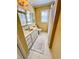 Well-lit bathroom featuring a shower with white tile and vanity at 946 Law Ln, Mount Pleasant, SC 29464