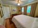 Inviting bedroom with a neutral color palette, featuring a comfortable bed, hardwood floors, and bright windows with natural light at 946 Law Ln, Mount Pleasant, SC 29464