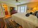 Bedroom featuring hardwood floors, a large window, and a ceiling fan at 946 Law Ln, Mount Pleasant, SC 29464