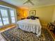Bedroom featuring hardwood floors, a large window, and a ceiling fan at 946 Law Ln, Mount Pleasant, SC 29464
