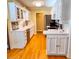 Bright kitchen featuring white cabinets, stainless steel appliances, and hardwood floors at 946 Law Ln, Mount Pleasant, SC 29464