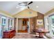 Bright sunroom featuring tile floors, large windows with backyard views, and transitional furnishings that create an inviting atmosphere at 946 Law Ln, Mount Pleasant, SC 29464