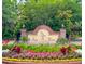 Community entrance sign amidst a vibrant array of colorful flower beds and lush landscaping at 946 Law Ln, Mount Pleasant, SC 29464