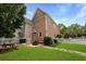 A cozy backyard with a firepit, white picket fence, patio and a well-maintained lawn at 101 Barberry St, Summerville, SC 29483