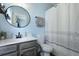 Bright bathroom featuring a vanity, toilet, and shower with a decorative curtain at 101 Barberry St, Summerville, SC 29483