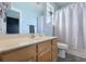 Bright bathroom with a light wood vanity, framed mirror, and shower-tub combo, creating a refreshing space at 101 Barberry St, Summerville, SC 29483