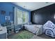 Charming bedroom with a chalkboard wall, playful decor, and cozy furnishings at 101 Barberry St, Summerville, SC 29483