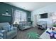 Comfortable Bedroom with a glider, a gray crib, and natural light from the window creates a calming environment at 101 Barberry St, Summerville, SC 29483