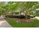 Community clubhouse nestled among mature trees, with well-maintained landscaping and sidewalk at 101 Barberry St, Summerville, SC 29483