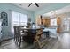 Dining area with a wooden table, chairs, and view into the adjacent kitchen at 101 Barberry St, Summerville, SC 29483
