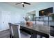 Dining area featuring a dark wood table, soft gray seating and an open view to the living space at 101 Barberry St, Summerville, SC 29483