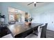 Bright dining room with an expansive view of the kitchen and a wooden table with seating at 101 Barberry St, Summerville, SC 29483
