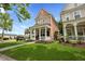 Beautiful two-story home with a welcoming porch, lush landscaping, and mature trees at 101 Barberry St, Summerville, SC 29483