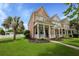 Charming two-story home with inviting front porch, manicured landscaping, and a palm tree at 101 Barberry St, Summerville, SC 29483