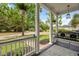 Inviting front porch with a porch swing, hanging plants, and an outdoor rug at 101 Barberry St, Summerville, SC 29483
