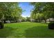Expansive community green space surrounded by mature trees and well-manicured landscaping at 101 Barberry St, Summerville, SC 29483