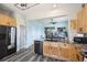 Modern kitchen with stainless steel appliances, granite countertops, and open layout to living area at 101 Barberry St, Summerville, SC 29483