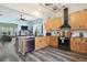 Bright open kitchen with stainless steel appliances and granite countertops flows into the dining and living areas at 101 Barberry St, Summerville, SC 29483