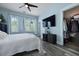 Airy main bedroom with walk-in closet, a large TV, and light blue walls at 101 Barberry St, Summerville, SC 29483