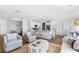 Open-concept living area with a kitchen island, cozy seating, and a dining area with a chandelier at 1033 Tea Time Dr, Summerville, SC 29485