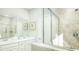 Modern bathroom with dual sinks, sleek finishes, and a glass-enclosed shower at 1034 Scotch Bonnet Way, Summerville, SC 29485