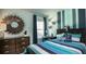 Charming bedroom with colorful striped walls, wood furniture, and playful decor at 1034 Scotch Bonnet Way, Summerville, SC 29485