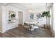 Bright dining area featuring shiplap walls, stylish mirror, and contemporary chandelier at 1034 Scotch Bonnet Way, Summerville, SC 29485