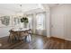 Bright dining area boasts shiplap walls, modern lighting, and large windows at 1034 Scotch Bonnet Way, Summerville, SC 29485