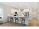 Modern kitchen with granite countertops, stainless steel appliances, and breakfast bar seating at 1034 Scotch Bonnet Way, Summerville, SC 29485