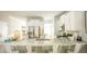 Open kitchen with granite countertops, stainless steel appliances, and bright white cabinetry at 1034 Scotch Bonnet Way, Summerville, SC 29485