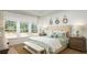 Serene main bedroom with natural light, decorative mirrors, and ample closet space at 1034 Scotch Bonnet Way, Summerville, SC 29485