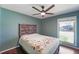 Bedroom showcasing hardwood floors, a ceiling fan, and a window providing natural light at 1039 Grand Concourse St, Charleston, SC 29412