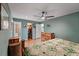 Bedroom with wood floors, ensuite bath, walk-in closet, and a ceiling fan at 1039 Grand Concourse St, Charleston, SC 29412