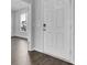 Entryway featuring wood flooring and a large front door, leading to a light-filled home at 1041 Tea Time Dr, Summerville, SC 29485