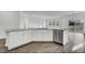 Large kitchen island with granite countertops, wood floors and stainless-steel appliances at 1041 Tea Time Dr, Summerville, SC 29485
