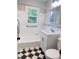Bathroom featuring a tiled floor, white vanity, and shower/tub combo with grab bars at 105 Dandridge Rd, Walterboro, SC 29488