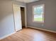 Charming bedroom with hardwood floors, closet, and a window overlooking a quiet neighborhood at 105 Dandridge Rd, Walterboro, SC 29488