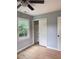 Bedroom view of closet, wood floor, window, neutral paint, and a ceiling fan at 105 Dandridge Rd, Walterboro, SC 29488