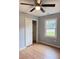 Bedroom featuring hardwood floors, a closet with sliding doors, and a window view at 105 Dandridge Rd, Walterboro, SC 29488