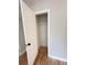 An open closet with a shelf showing the available storage space and hardwood floors at 105 Dandridge Rd, Walterboro, SC 29488