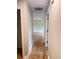 Hallway with hardwood floors leading to a bright, airy living space at 105 Dandridge Rd, Walterboro, SC 29488
