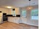 Kitchen features stainless steel appliances, butcher block countertops, and black backsplash at 105 Dandridge Rd, Walterboro, SC 29488