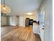 Spacious living room and kitchen area featuring hardwood floors and modern lighting at 105 Dandridge Rd, Walterboro, SC 29488
