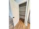 Open door showcases pantry with wooden shelving at 105 Dandridge Rd, Walterboro, SC 29488